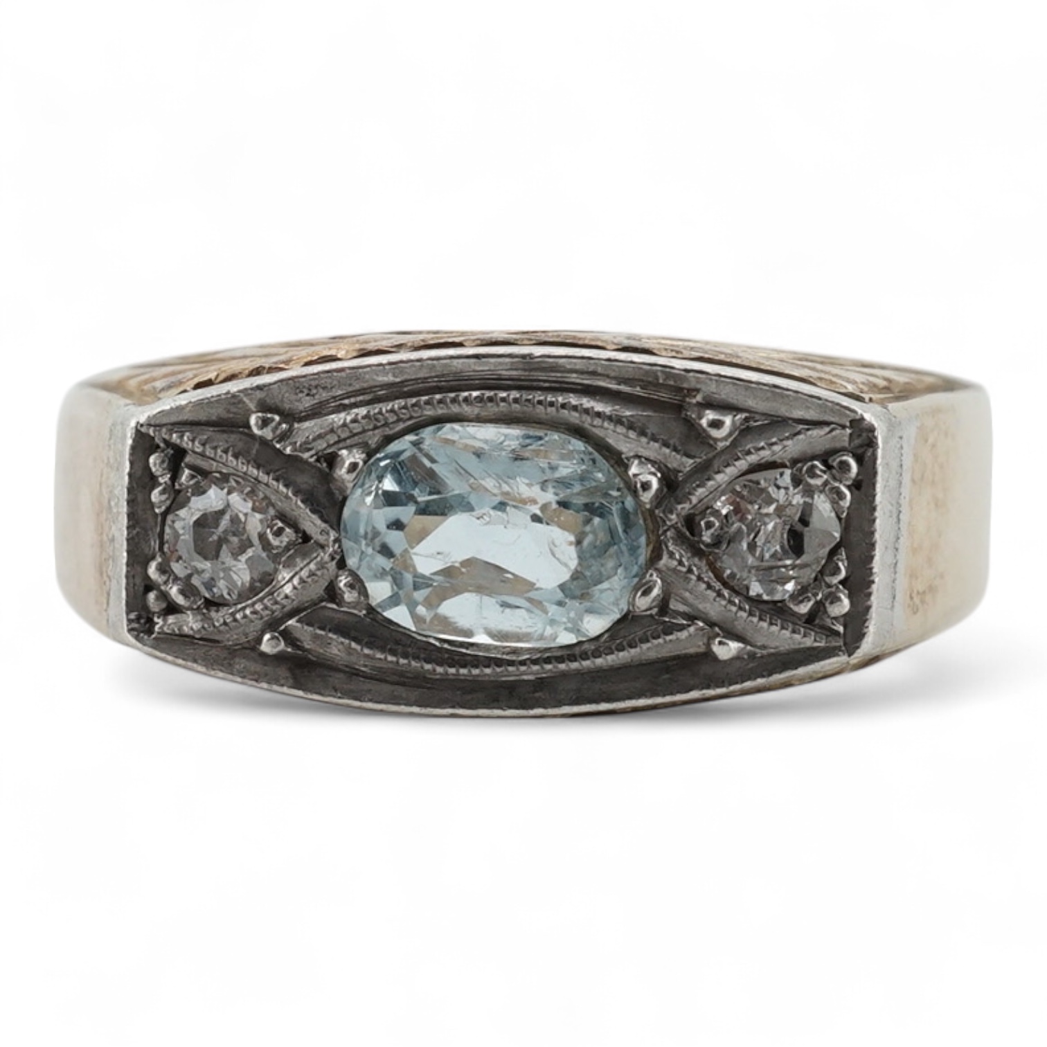 A mid 20th century yellow metal (stamped 585), aquamarine and diamond set three stone ring, size 0, gross weight 4.6 grams.